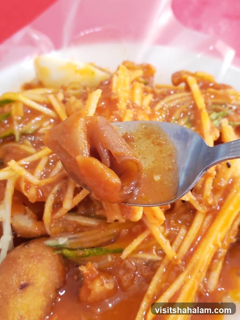 Close-up of a Spoonful of Rojak
