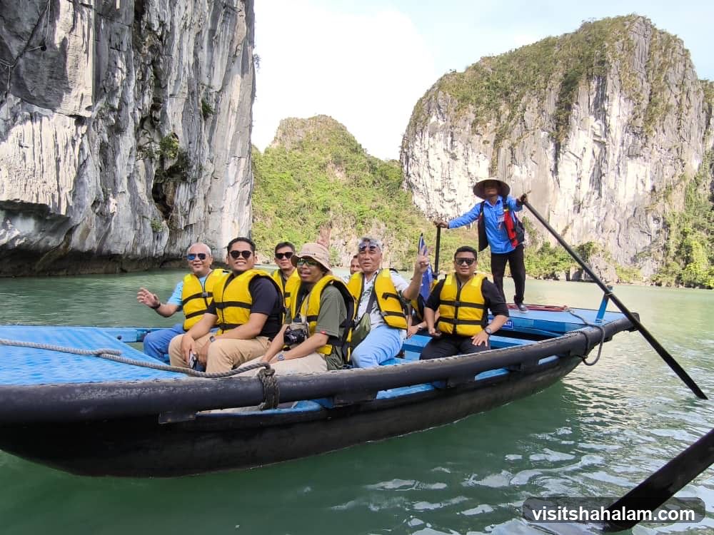 Tourists on a Boat in a Karst Landscape