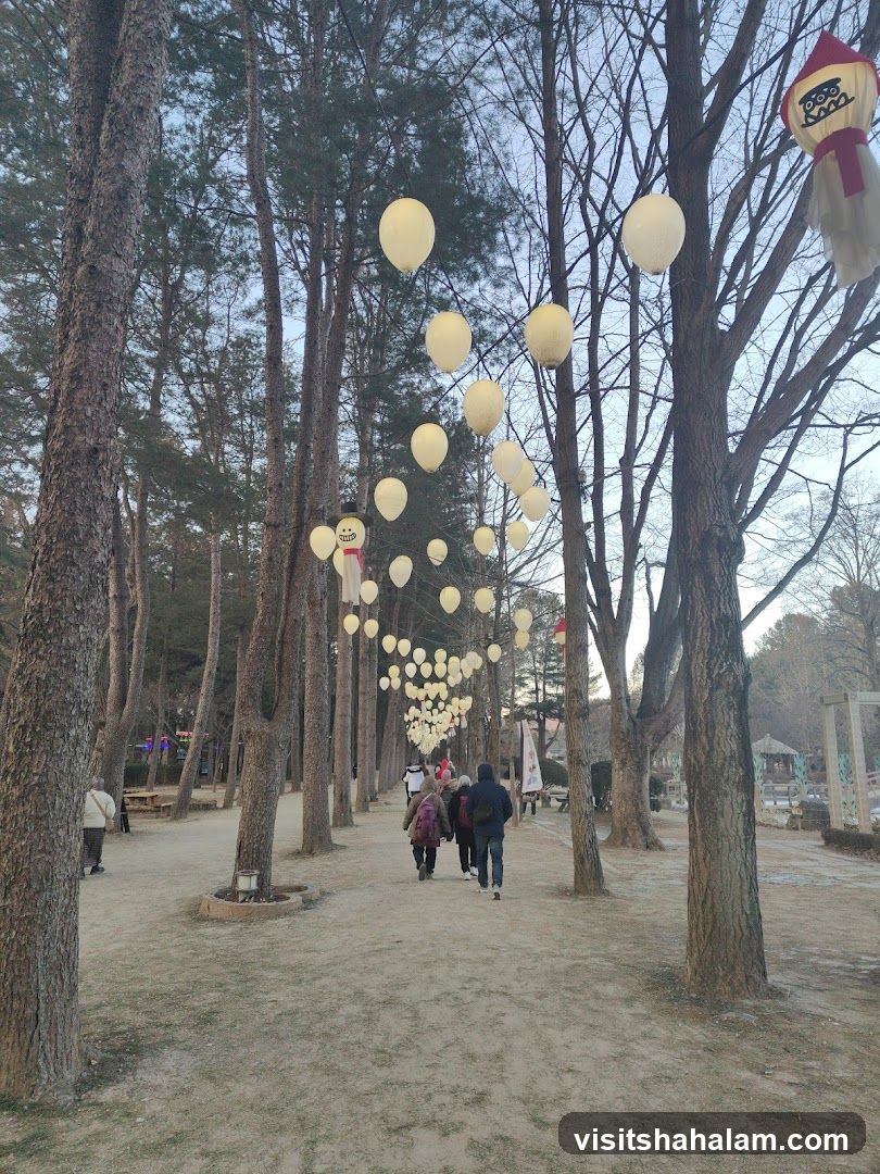 Path decorated with lanterns and figures