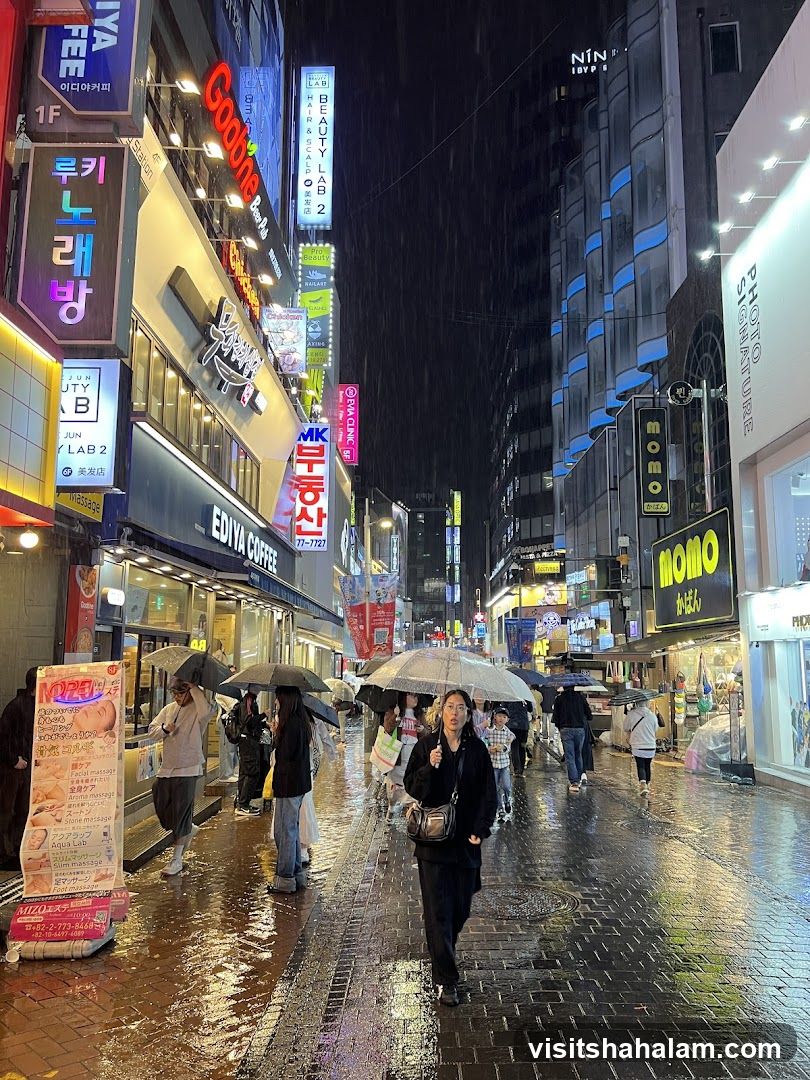 Rainy Night in a Bustling City Street