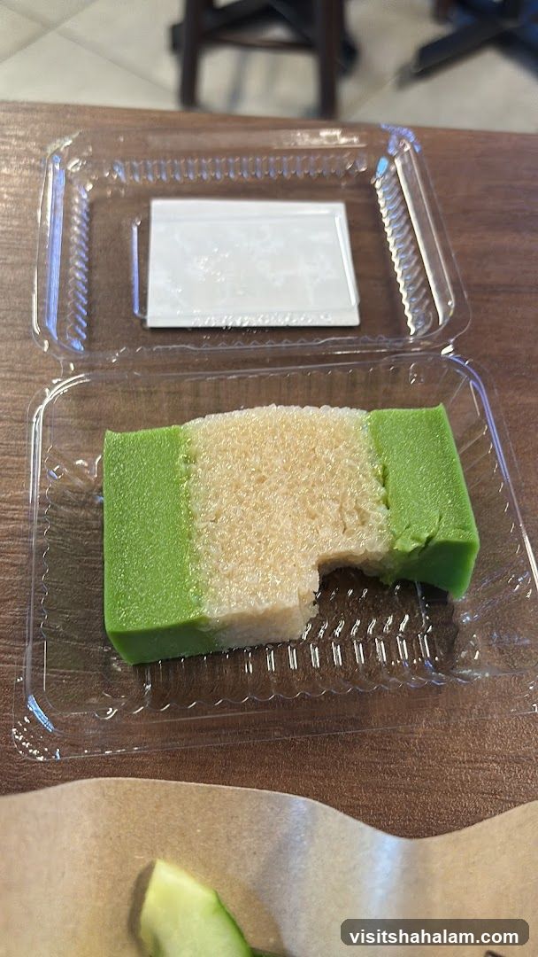 Bite taken from a green and white dessert