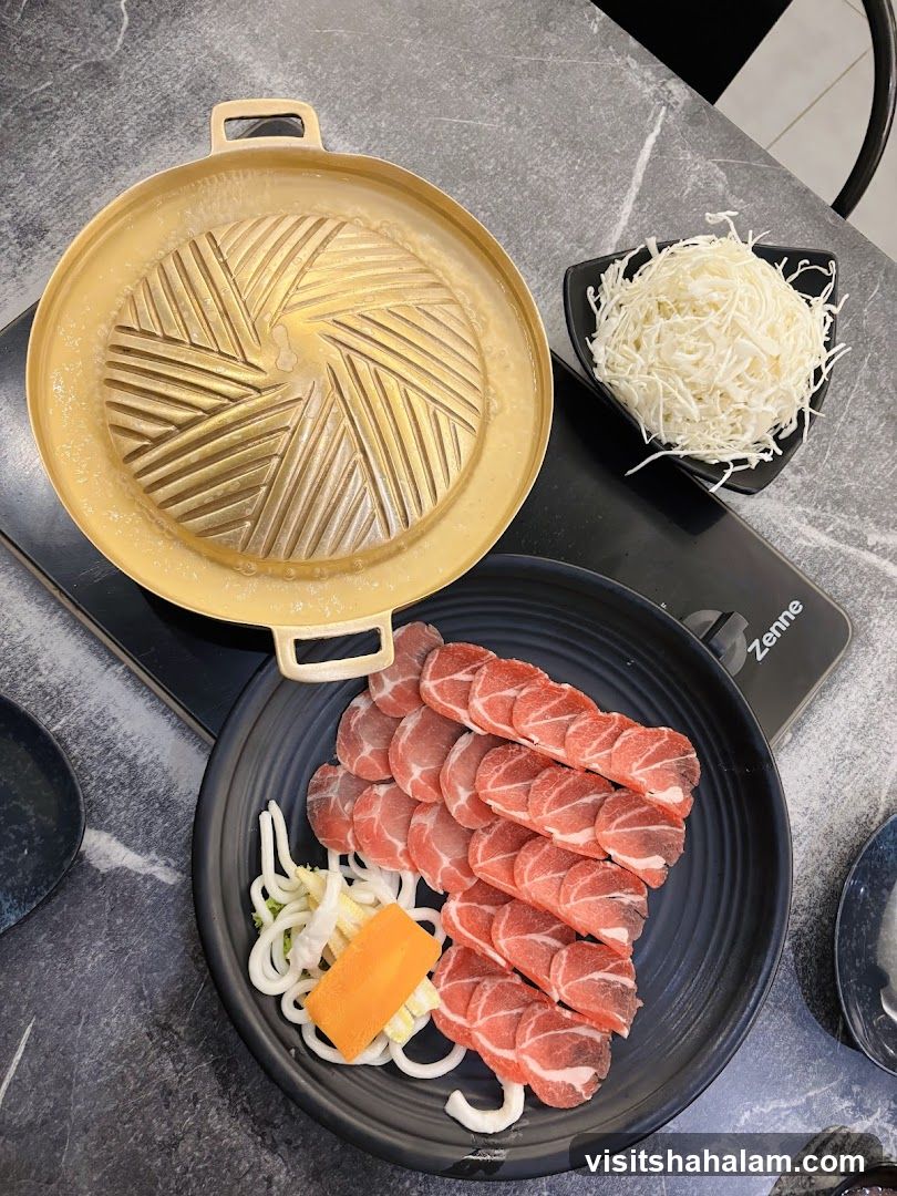 Grill Pan with Sliced Meat and Cabbage