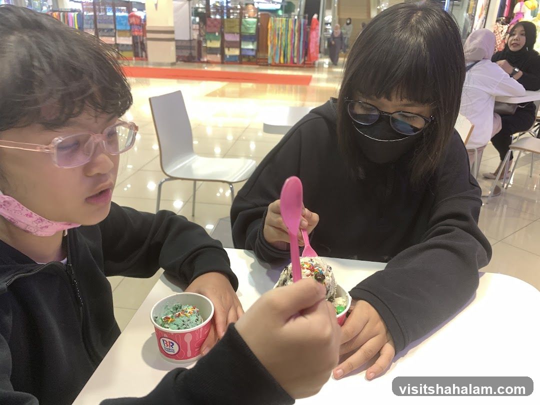 Two girls eating ice cream