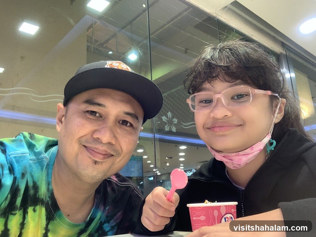 Father and Daughter Enjoying Ice Cream