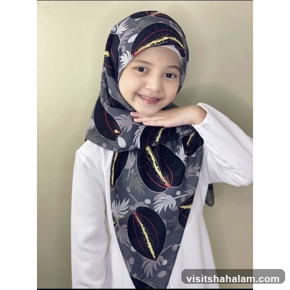 Young girl wearing a patterned hijab