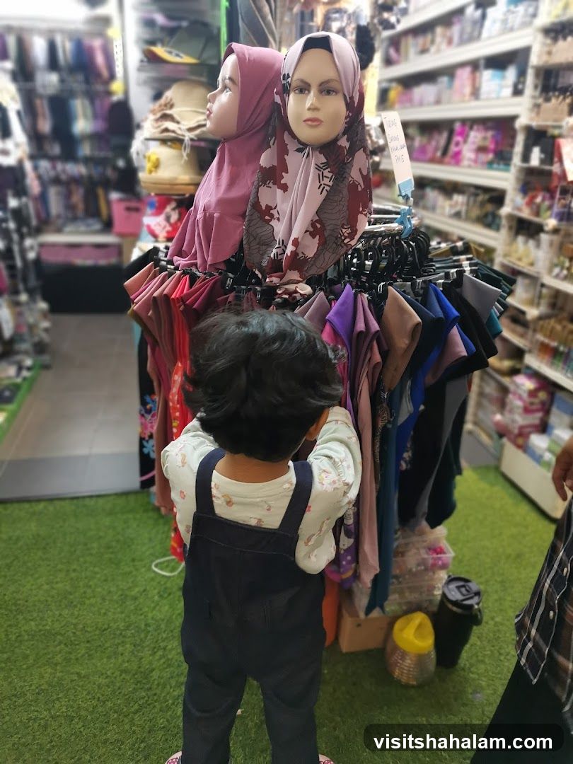 Child looking at hijabs on display