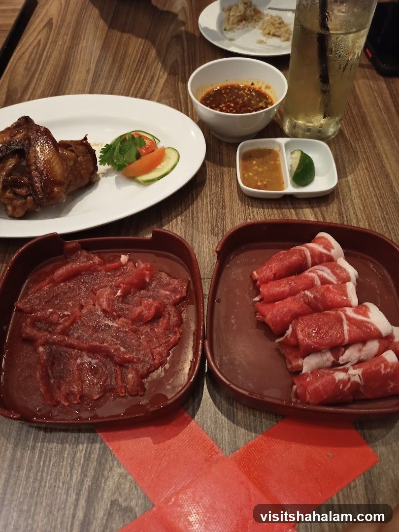 Diners' Table with Raw Meat and Cooked Chicken
