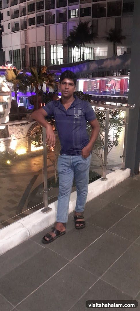 Man posing in front of a building