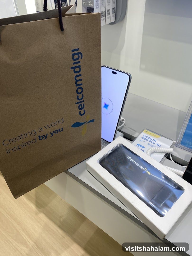 CelcomDigi branded shopping bag and phone display