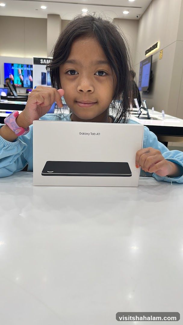 Girl Holding Galaxy Tab A11 Box