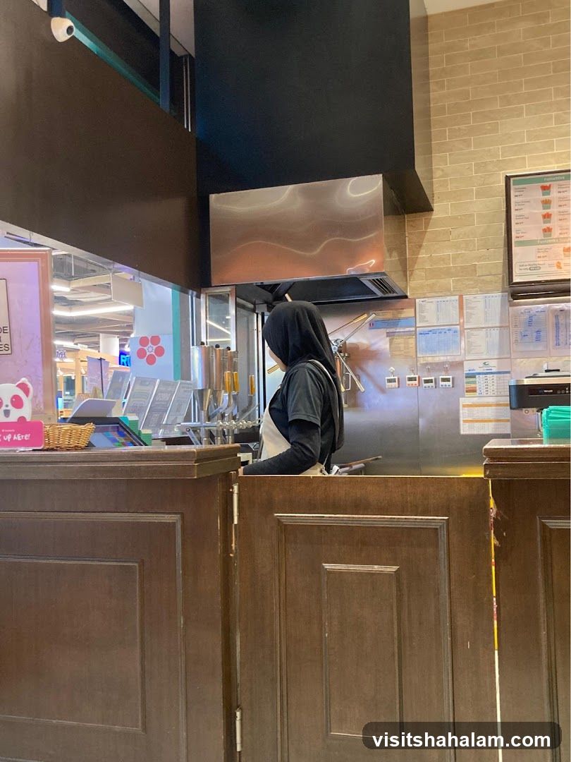 Staff preparing drinks behind counter