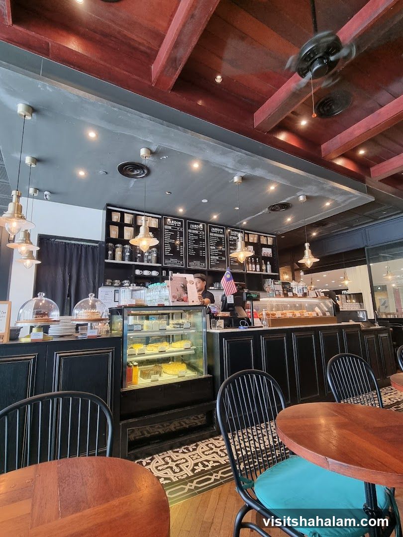 Cafe Interior with Cakes and Menu Boards
