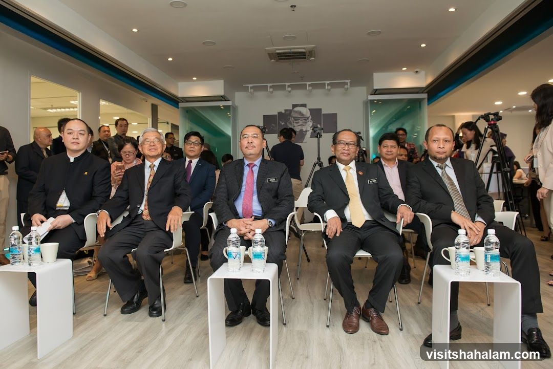 Group of men in suits sitting in chairs