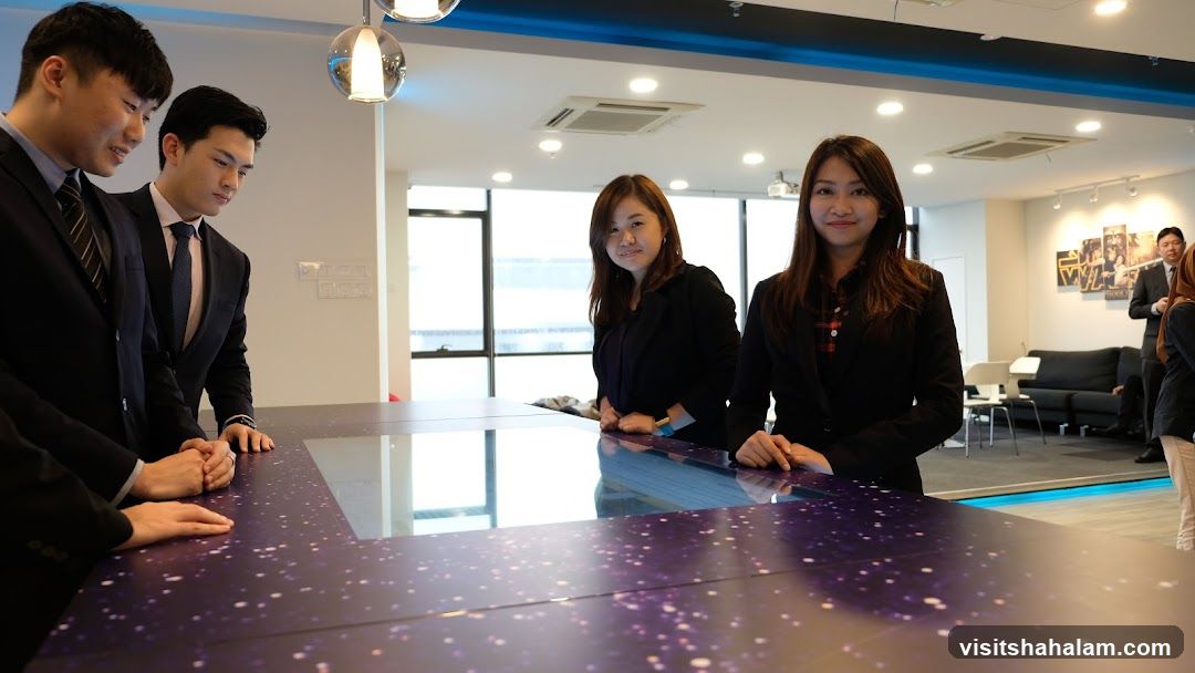 Colleagues gathered around a digital table