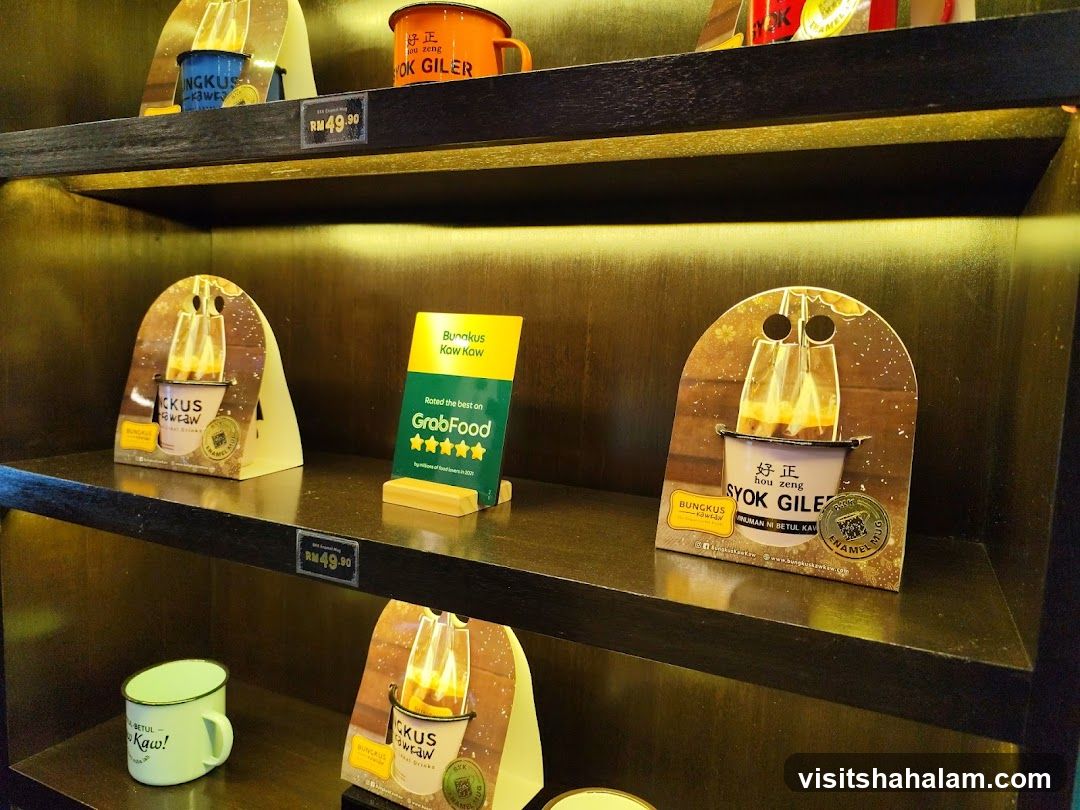 Display shelves with branded mugs and promotional materials