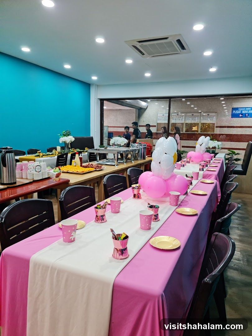 Party Setup with Long Tables and Pink Decorations