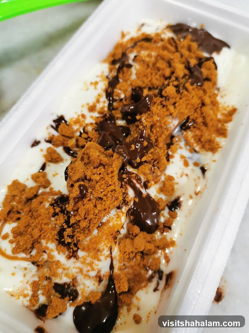Dessert with Crushed Biscuits and Chocolate Sauce