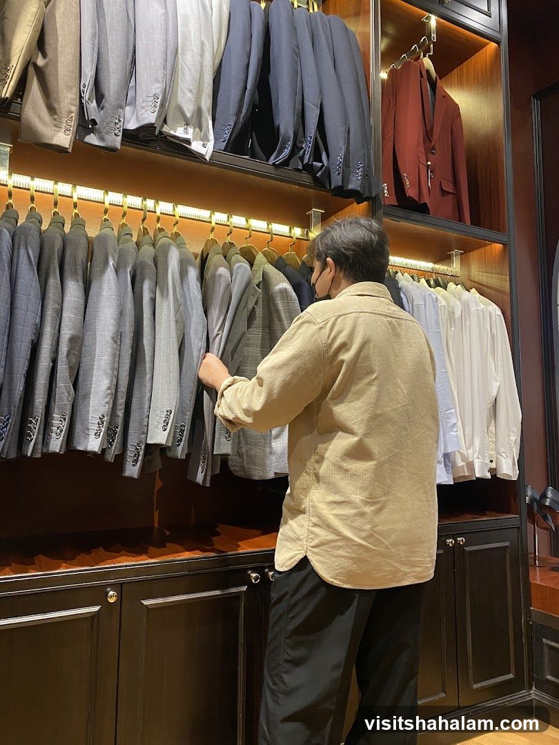 Man browsing jackets in a store