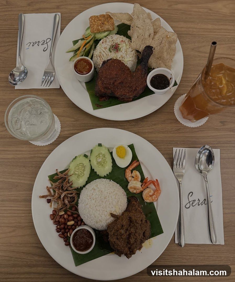 Two plates of Malaysian cuisine with drinks