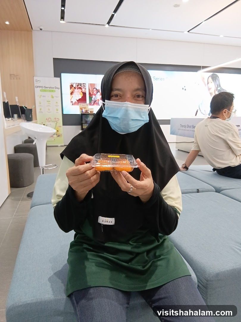 Woman holding a container of food