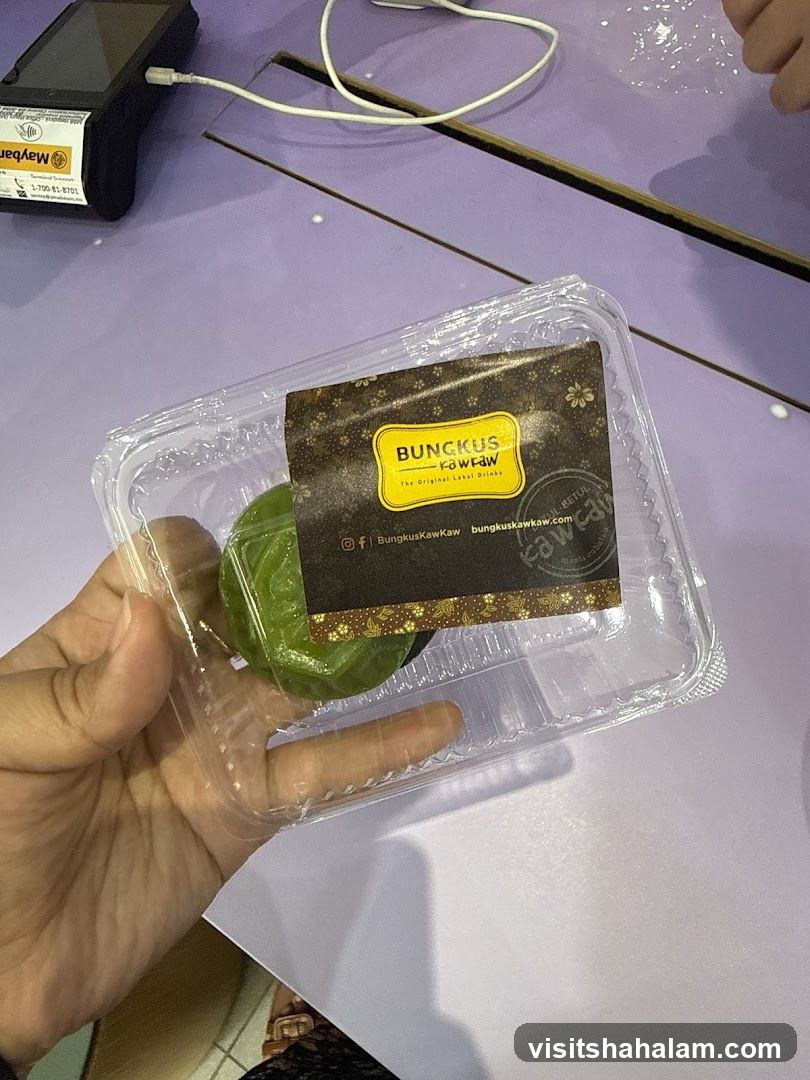 Green dessert in plastic container