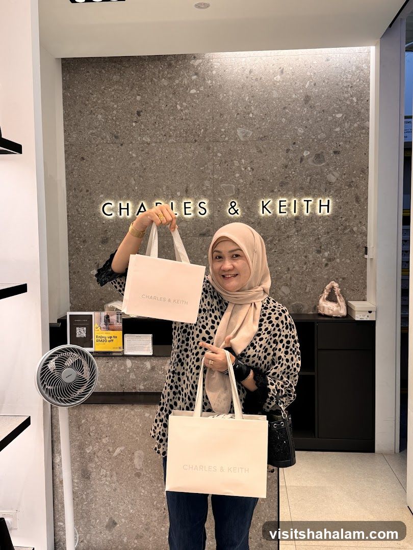 Woman Holding Shopping Bags in Charles & Keith Store