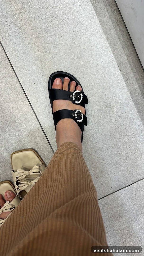 Black slides with jeweled buckles