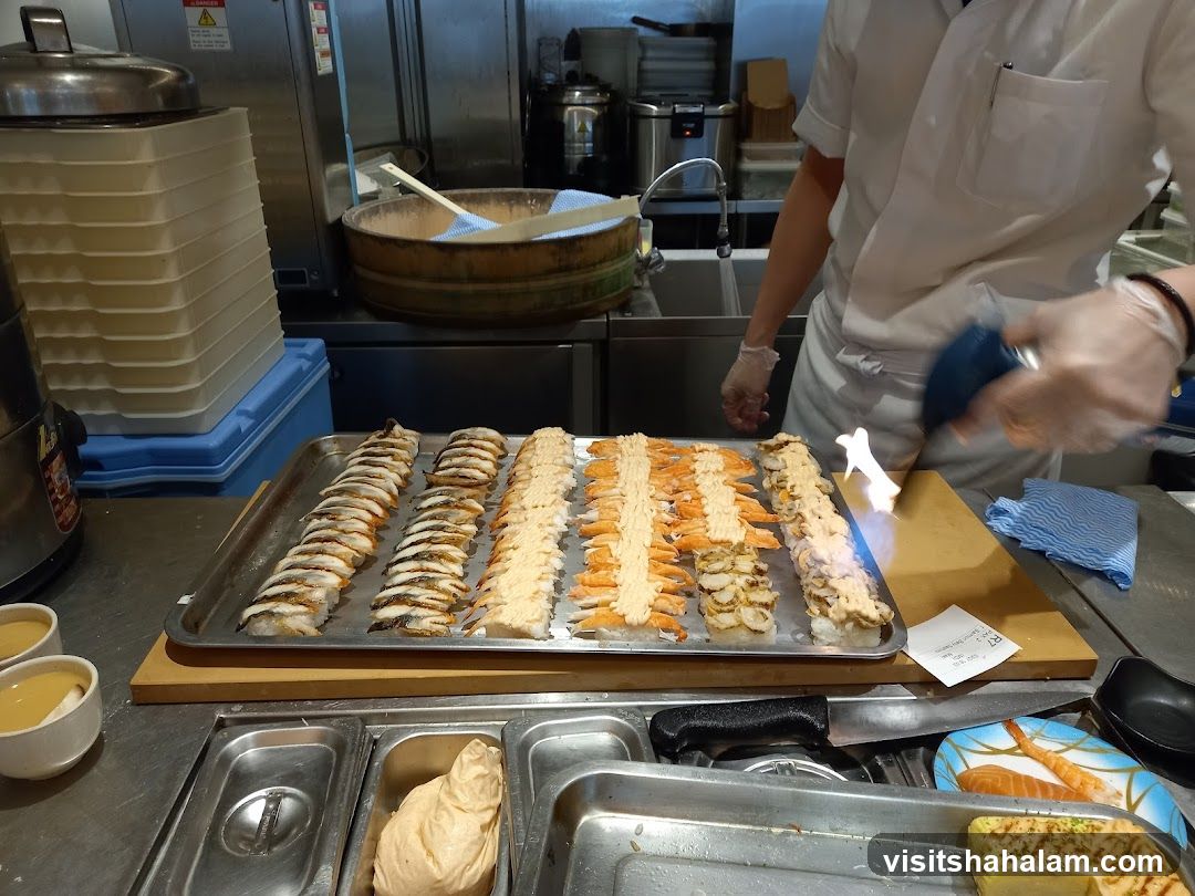 Chef Torching Sushi Rolls