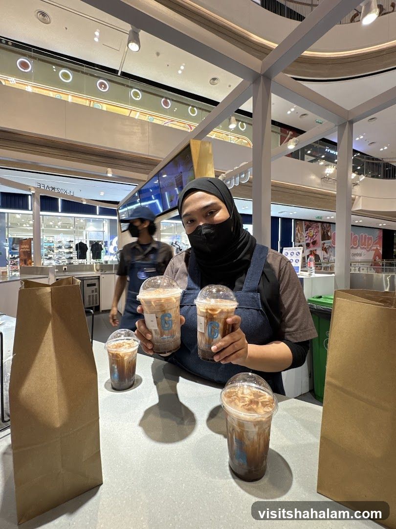 Barista Holding Coffee Drinks