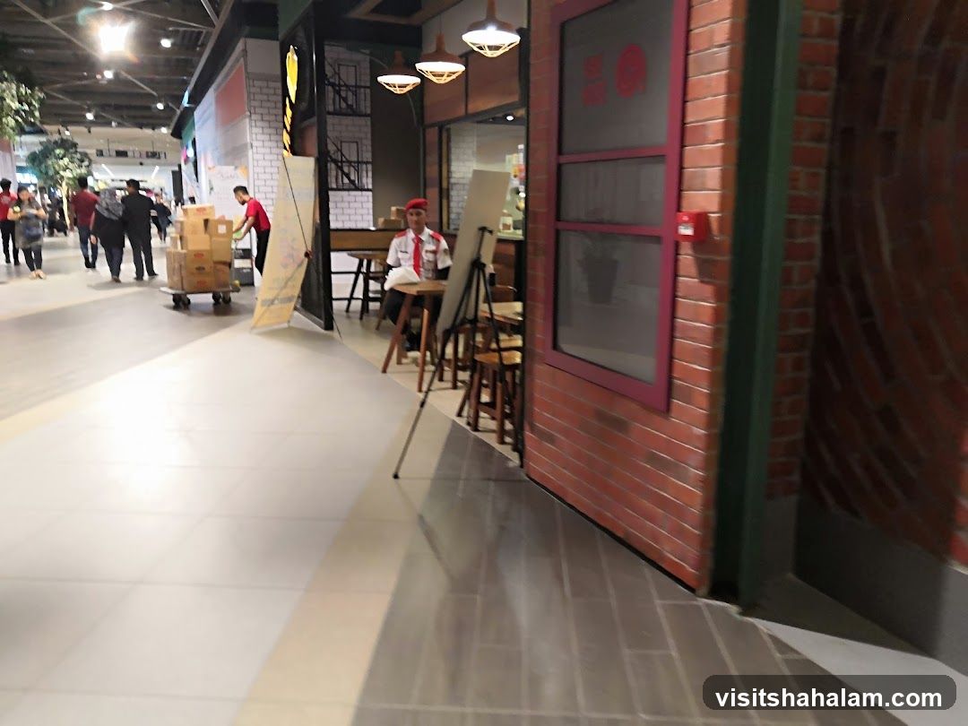 Mall walkway with a cafe entrance