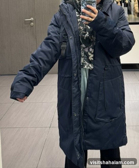 Person wearing a dark blue parka