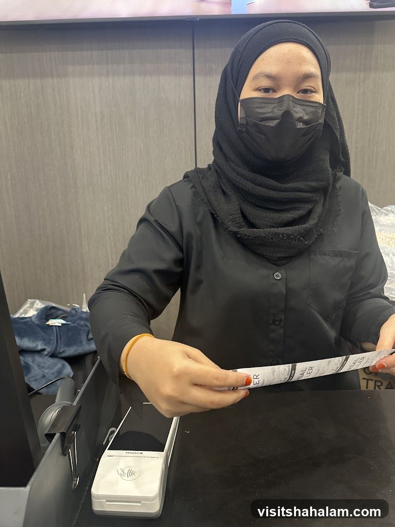 Cashier Holding Receipt