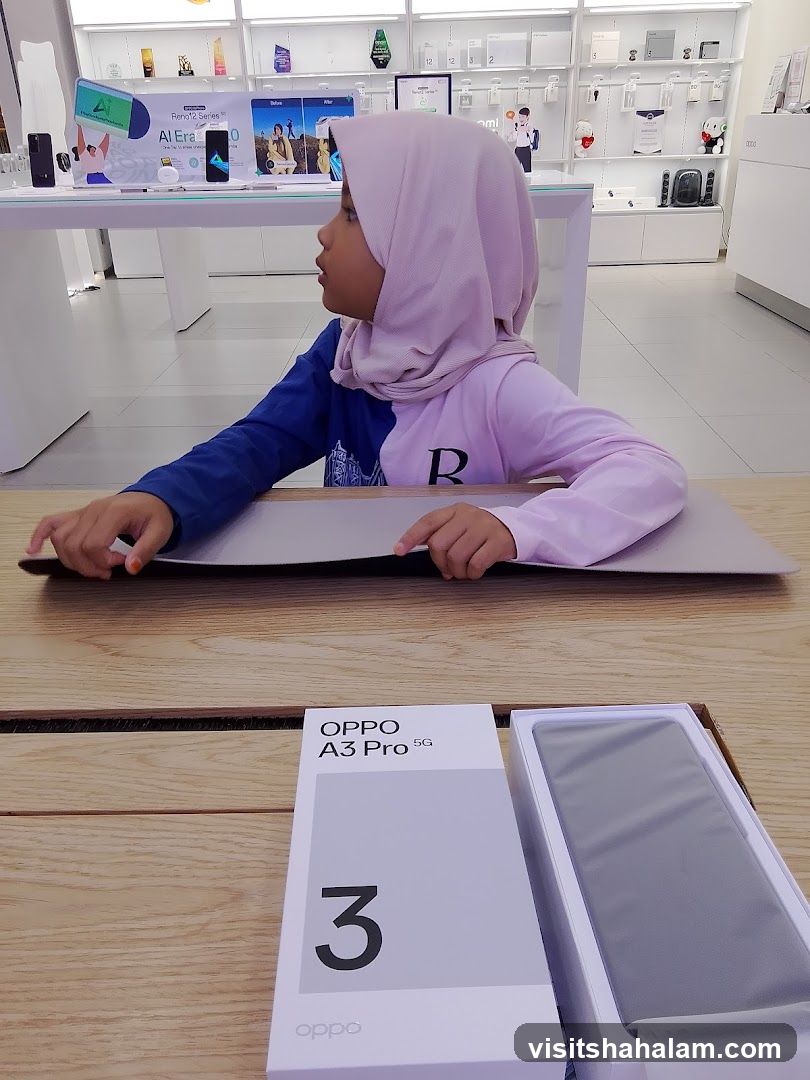 Child looking at display in electronics store