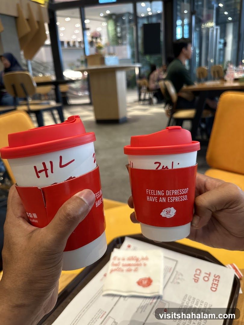 Two coffee cups with red sleeves