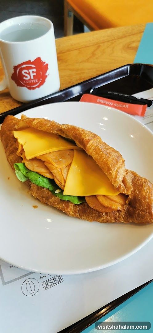Croissant Sandwich with Coffee Mug