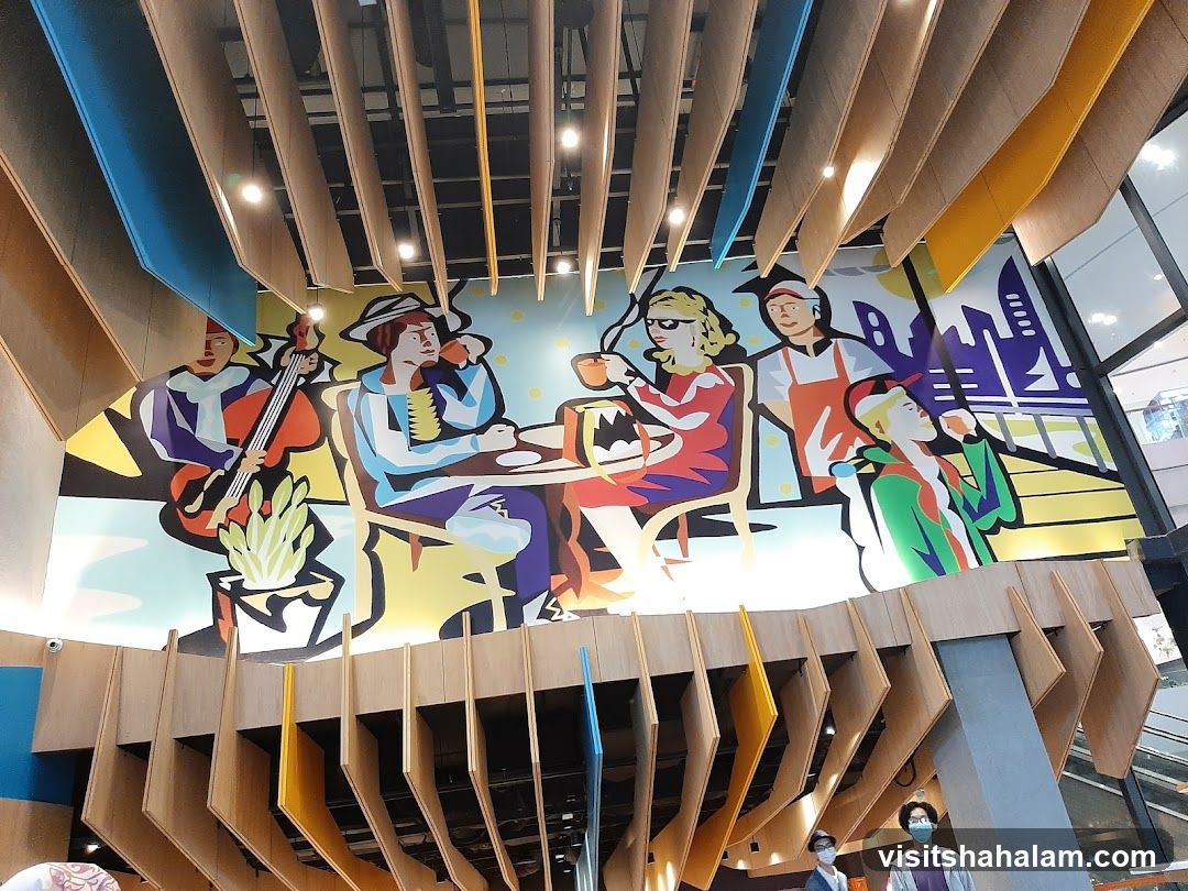 Mural of people enjoying coffee and music