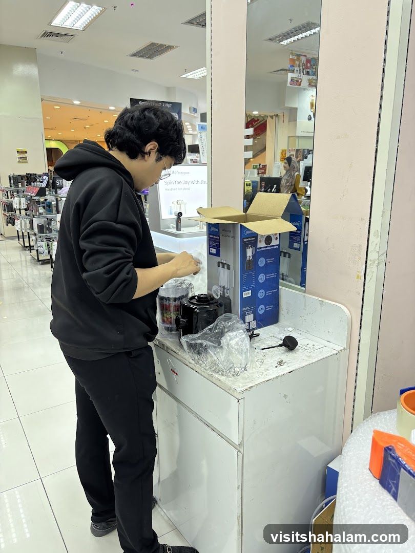 Person unpacking a blender