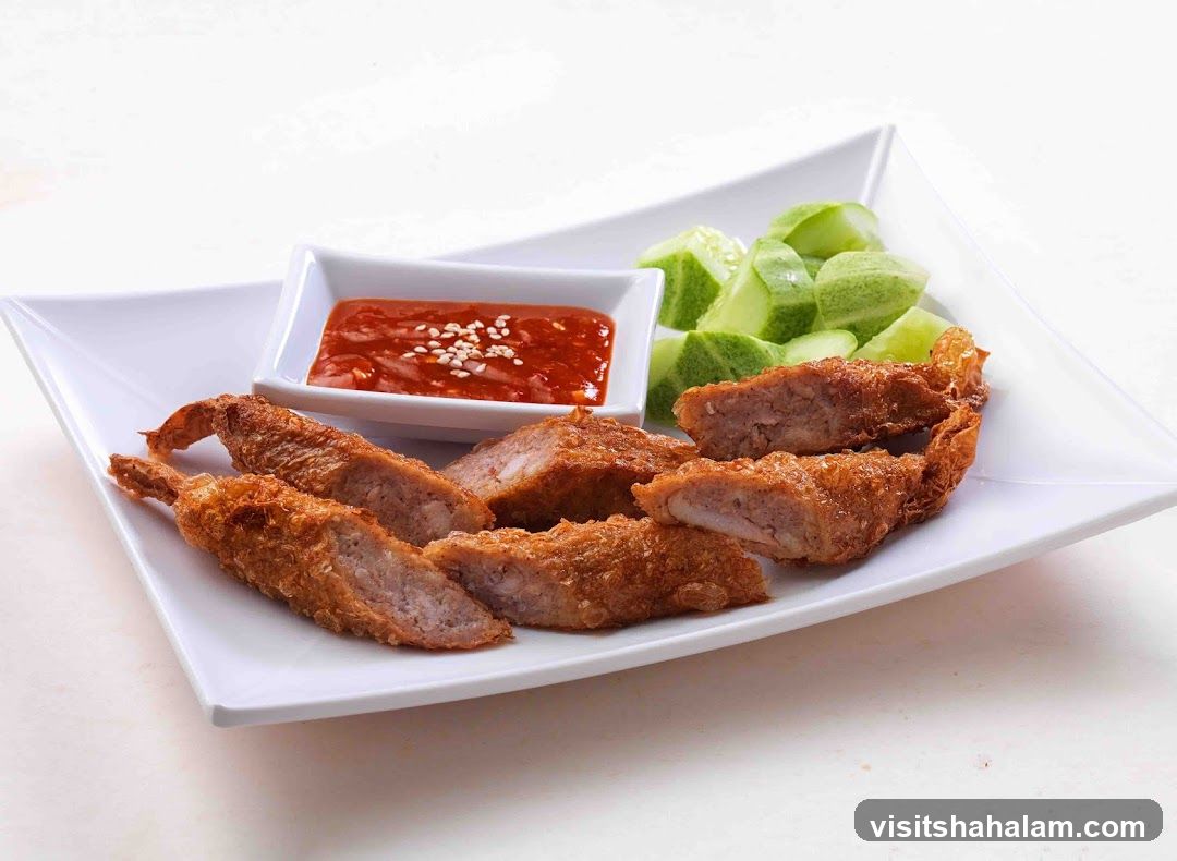 Fried Shrimp Rolls with Dipping Sauce and Cucumber Slices