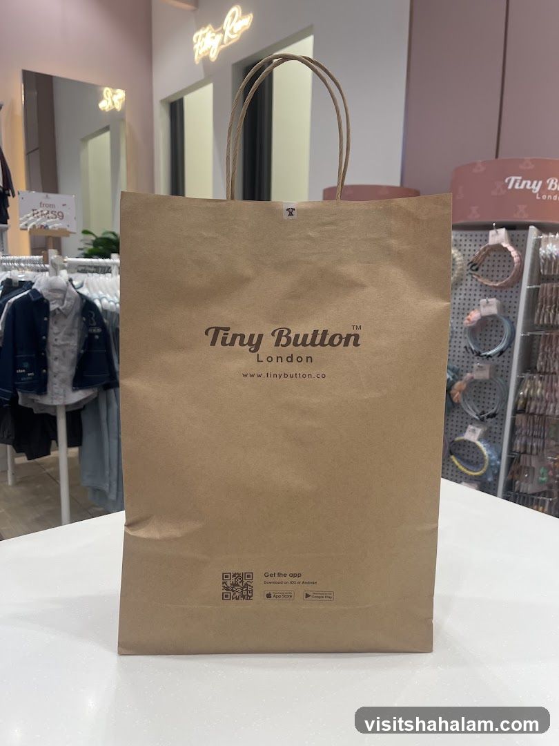 Brown paper shopping bag with store logo