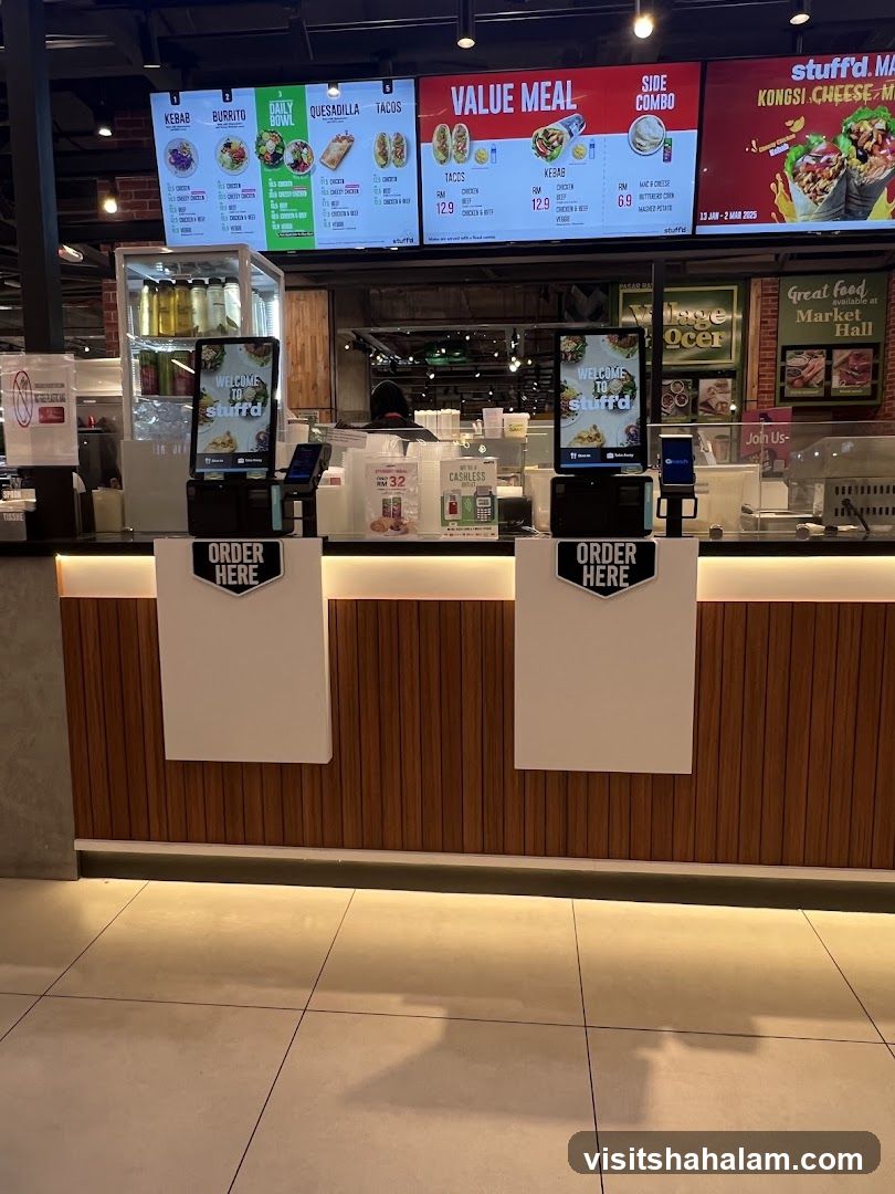 Food stall counter with digital menus and order stations