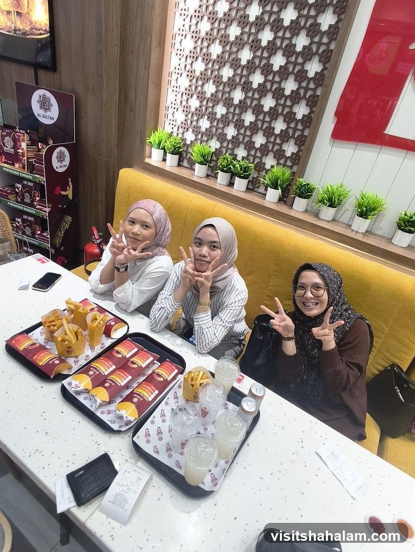 Friends Enjoying Food at Al Sultan