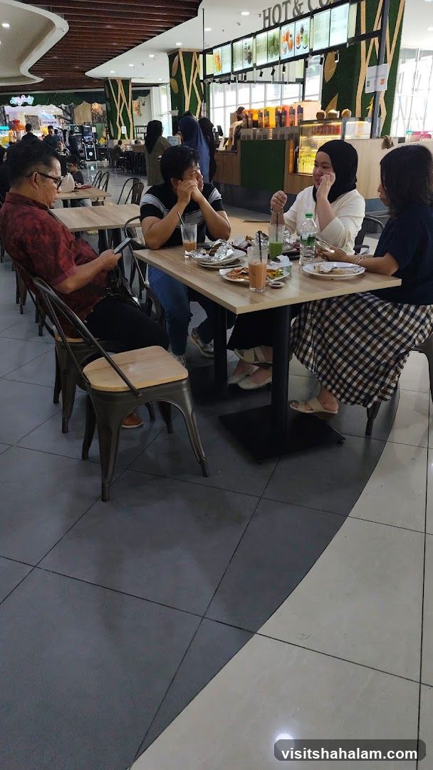 People eating at a food court