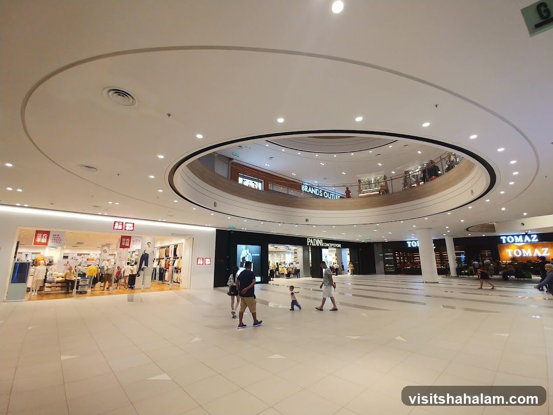 Interior of a shopping mall with various stores