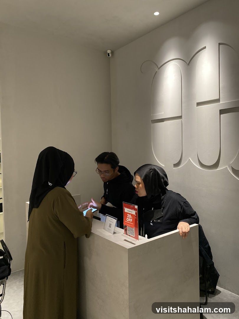 Staff assisting customers at a counter