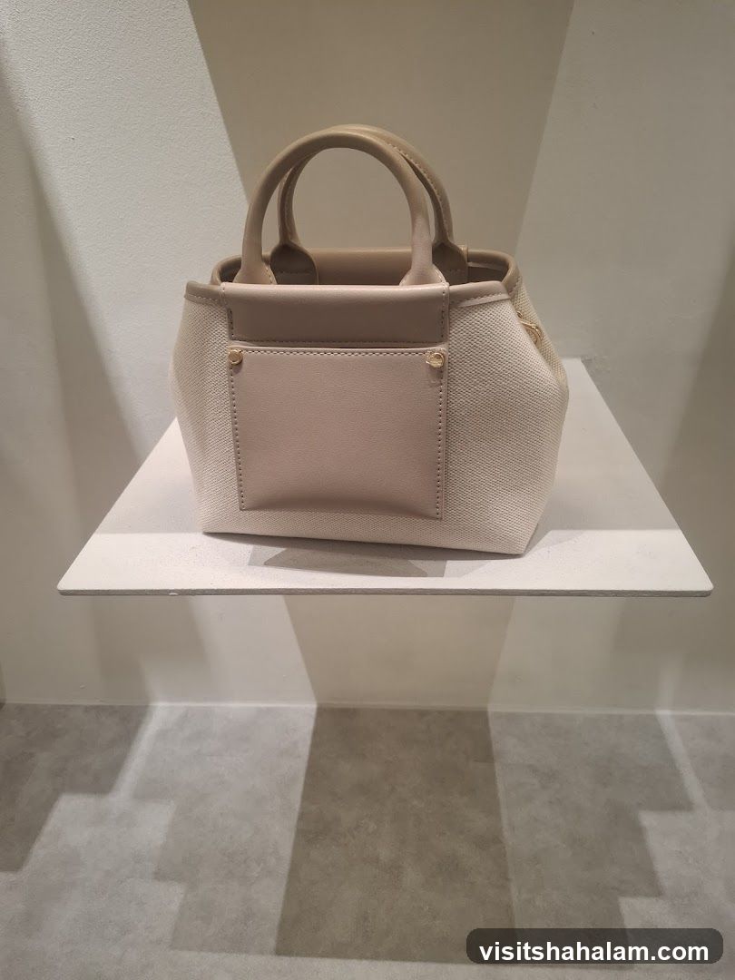 Beige handbag on a shelf