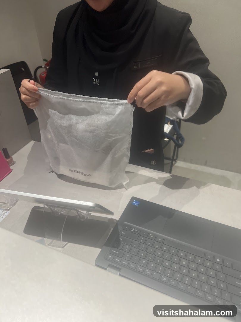 Employee holding a drawstring bag