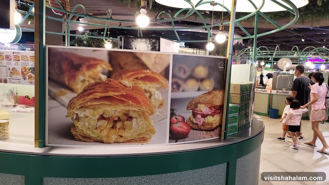 Food stall with large pastry images