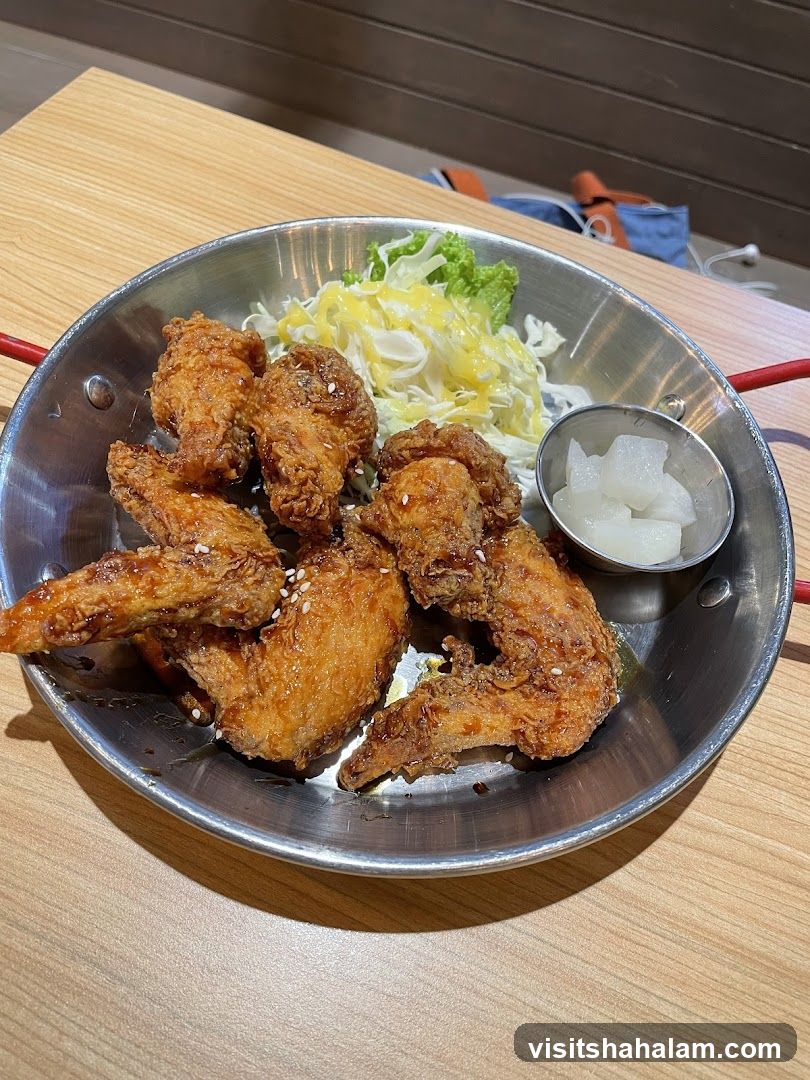Fried Chicken Wings with Salad and Pickled Radish