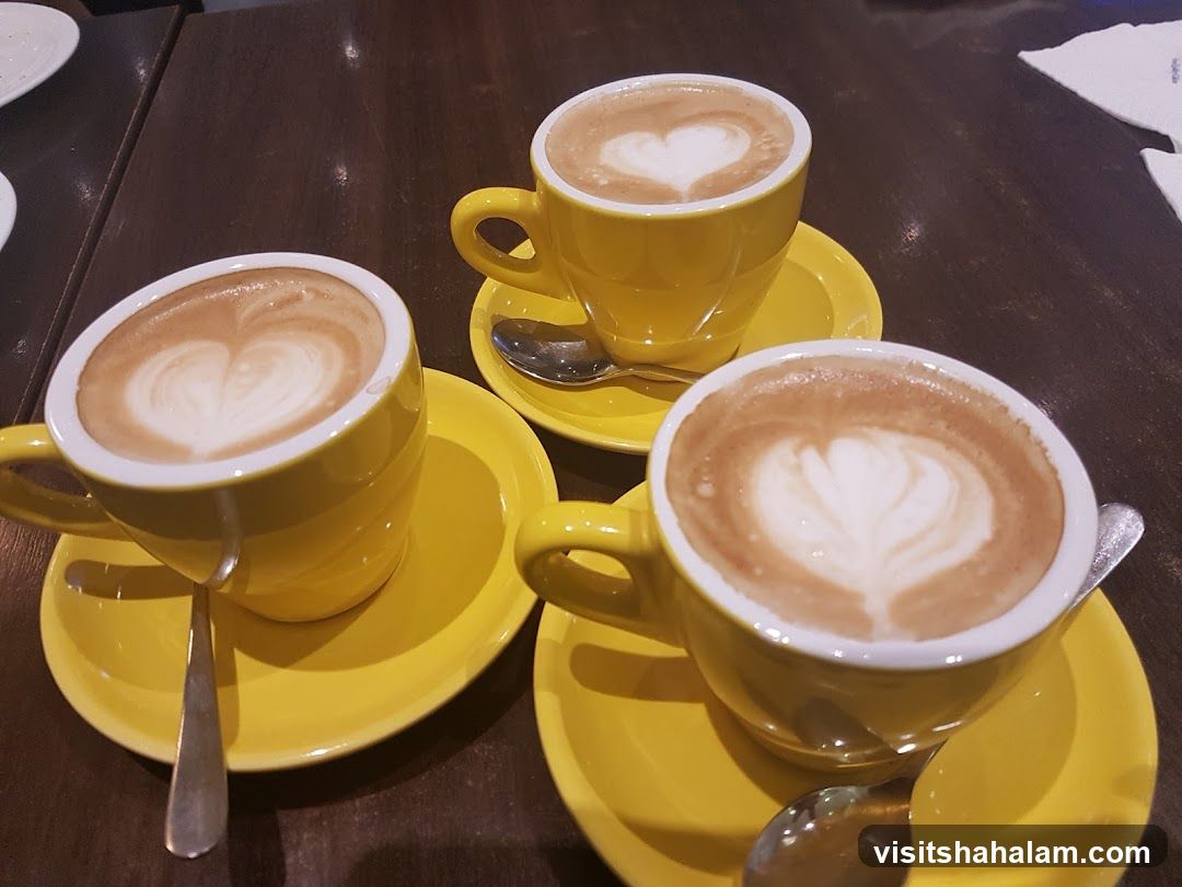 Three cups of coffee with latte art