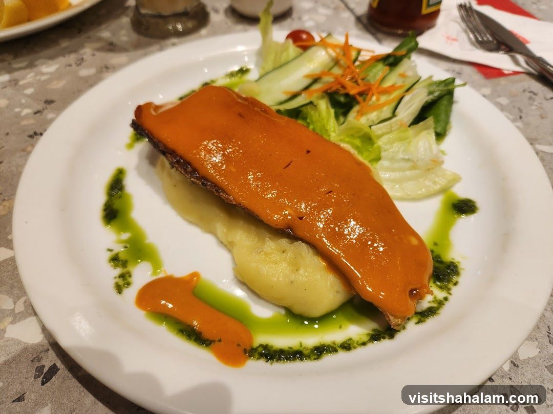 Fish dish with mashed potatoes and salad